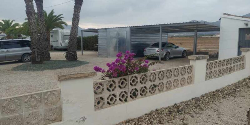 3 bay carport with storage shed extension
